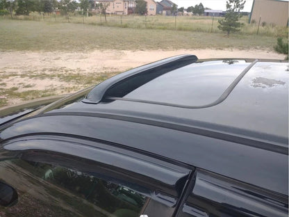 Universal dark smoke sunroof wind deflector installed on vehicle roof with low-profile fit