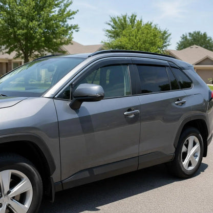 Toyota RAV4 smoke tape-on window vent deflectors installed for sun shade and fresh air
