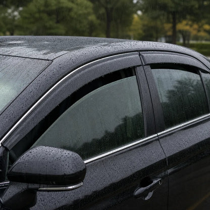 Toyota Camry with smoke window visor rain guards installed in rainy weather