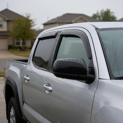 Toyota Tacoma Crew Cab with smoke outside-mount window visor rain guards installed