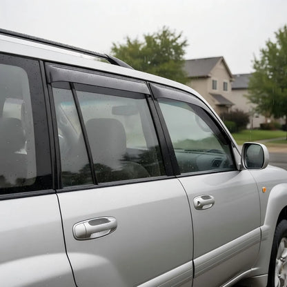 Toyota Land Cruiser with smoke outside-mount window visor rain guards installed