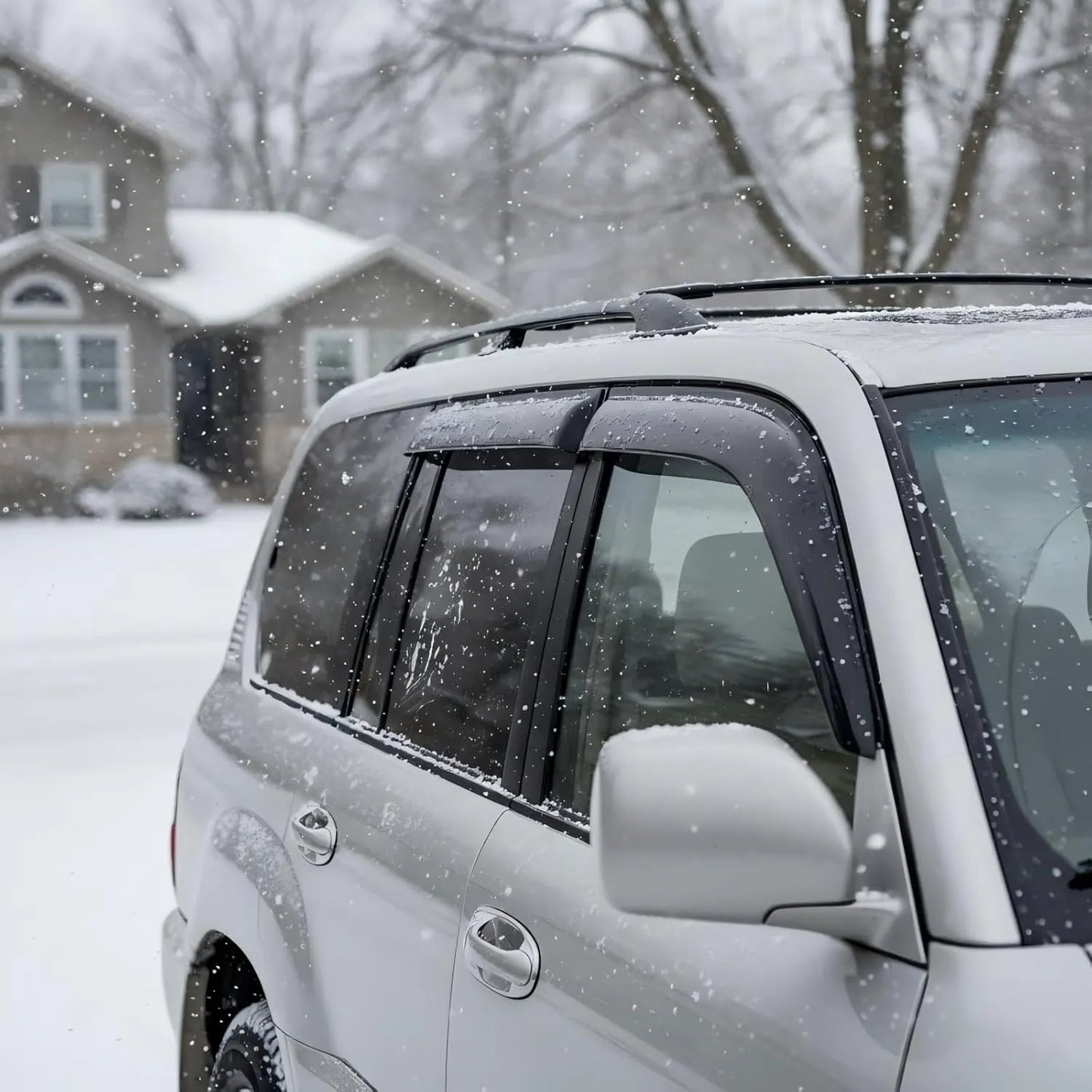 Toyota Land Cruiser with smoke window visor rain guards installed in snowy weather