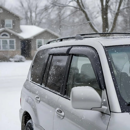 Toyota Land Cruiser with smoke window visor rain guards installed in snowy weather