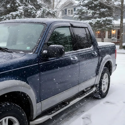 Ford Explorer with smoke window visor rain guards installed in snowy weather
