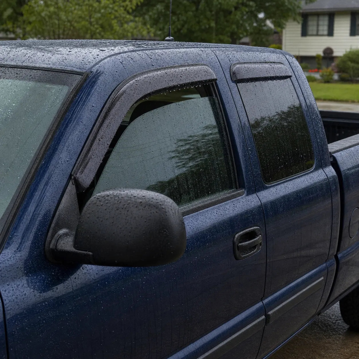 Chevy Silverado Extended Cab with smoke window visor rain guards installed on side windows