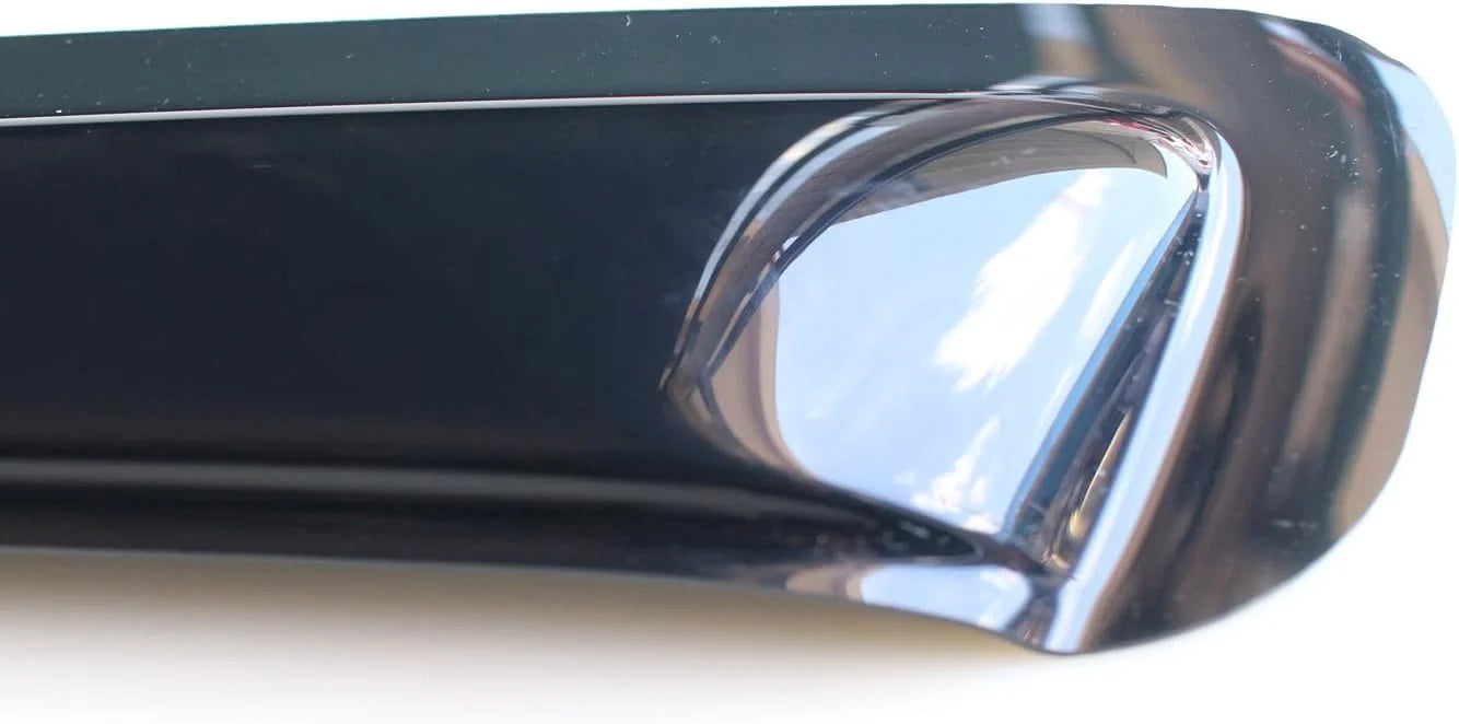 Close-up detail of smoke sunroof wind deflector edge and glossy plastic finish