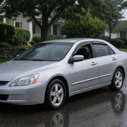 Honda Accord Sedan with smoke window vent deflectors installed in rainy weather