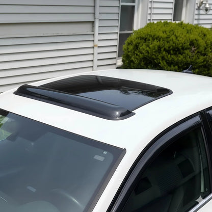 Universal smoke sunroof wind deflector installed above a vehicle sunroof opening